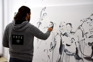 Patricio Hidalgo pintando "Sueño de una fiesta flamenca" para la exposición Pastora.